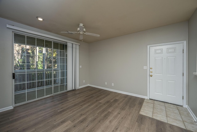 unfurnished room featuring ceiling fan and wood-type flooring