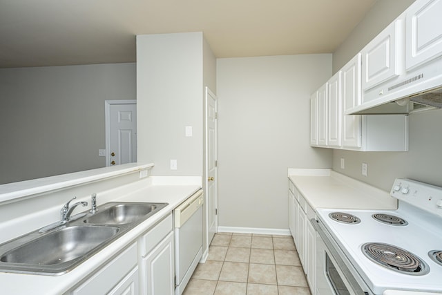 kitchen featuring white cabinets, light tile patterned floors, sink, and white appliances