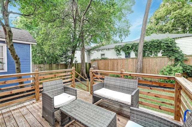 wooden deck featuring a fenced backyard