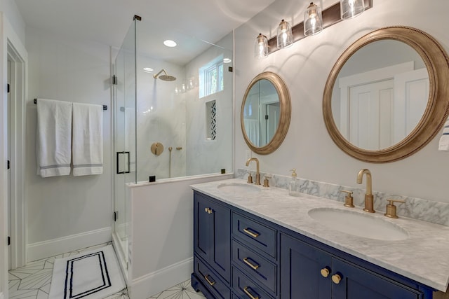 bathroom with double vanity, a sink, and a stall shower
