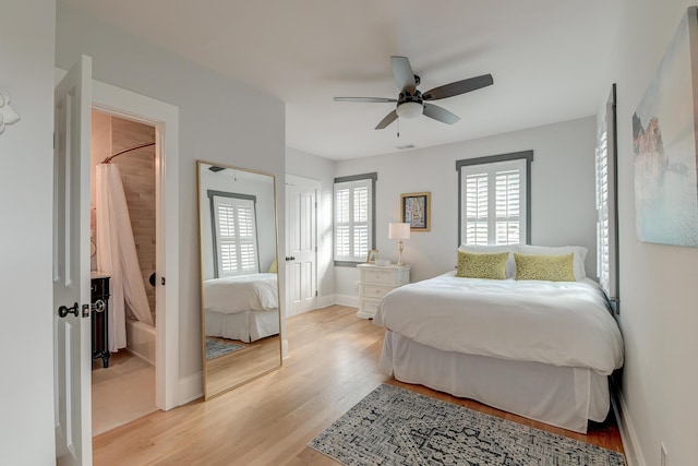 bedroom with baseboards, ceiling fan, and light wood-type flooring