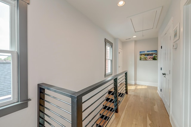hall featuring recessed lighting, an upstairs landing, attic access, and light wood-style floors