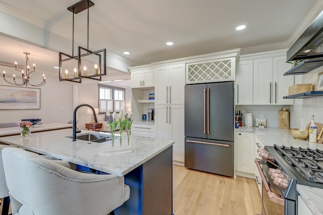 kitchen with a sink, appliances with stainless steel finishes, white cabinets, and ornamental molding