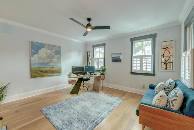 office featuring crown molding, baseboards, and light wood-type flooring