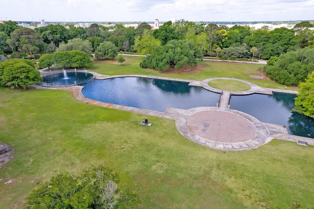 view of pool featuring a lawn