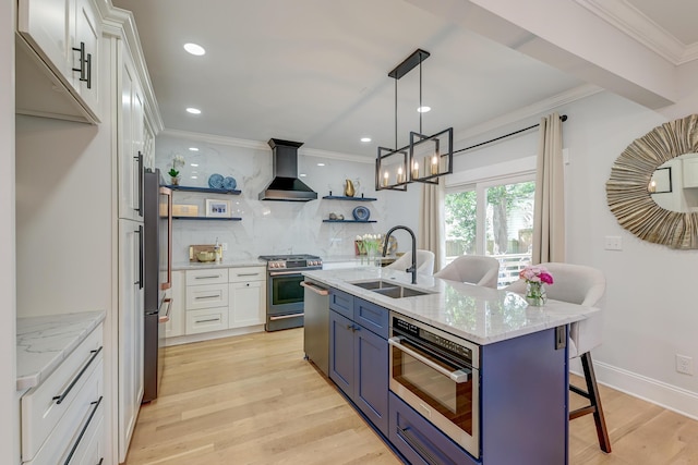 kitchen featuring crown molding, open shelves, wall chimney range hood, a sink, and appliances with stainless steel finishes