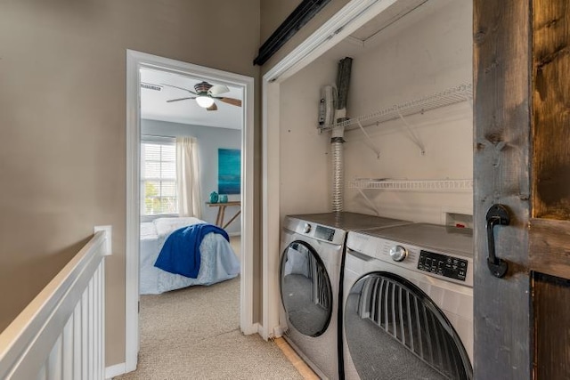 laundry room with laundry area, baseboards, a ceiling fan, and washer and dryer