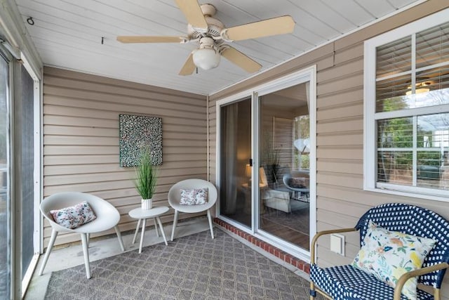 sunroom with a ceiling fan