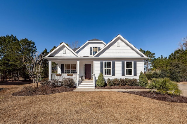 view of front facade with a porch and a front yard