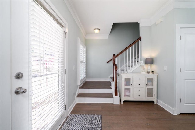 entryway featuring ornamental molding, stairway, wood finished floors, and baseboards