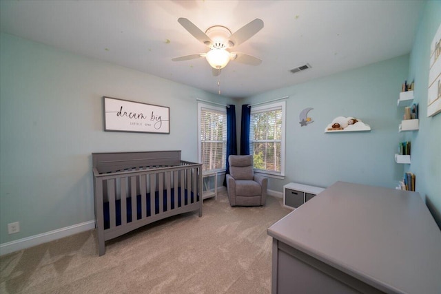 bedroom featuring visible vents, ceiling fan, light carpet, and baseboards