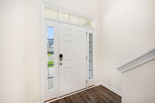entrance foyer with baseboards and dark wood-style flooring