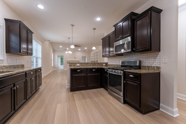 kitchen featuring appliances with stainless steel finishes, light wood-type flooring, baseboards, a peninsula, and recessed lighting