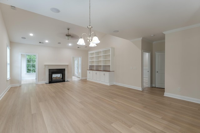 unfurnished living room with light wood-style floors, a chandelier, baseboards, a multi sided fireplace, and ornamental molding