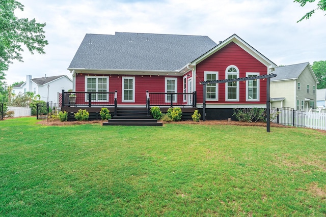 view of front facade featuring a deck and roof with shingles