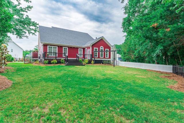 view of front of home featuring a deck and a shingled roof