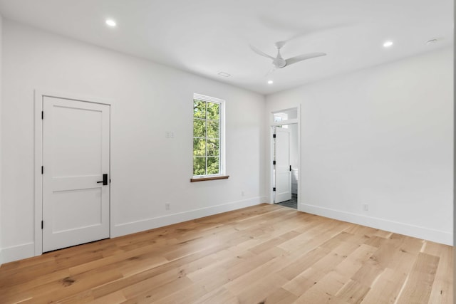unfurnished room with baseboards, light wood-style flooring, a ceiling fan, and recessed lighting