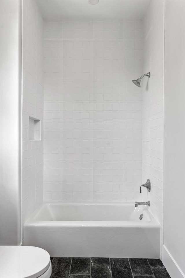 full bathroom with toilet, tub / shower combination, and tile patterned flooring