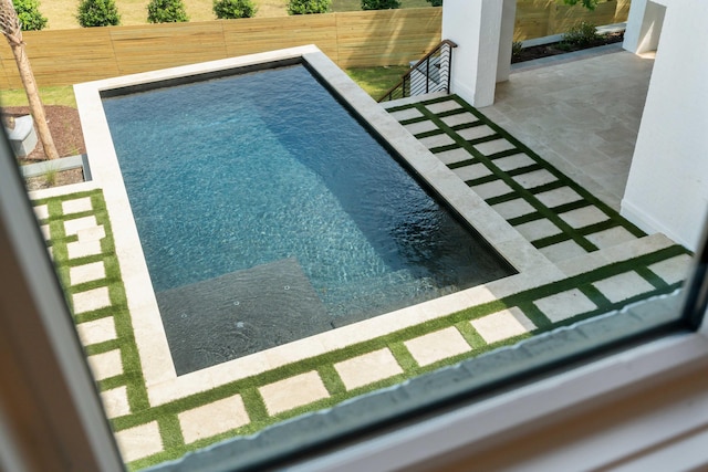 view of pool with fence