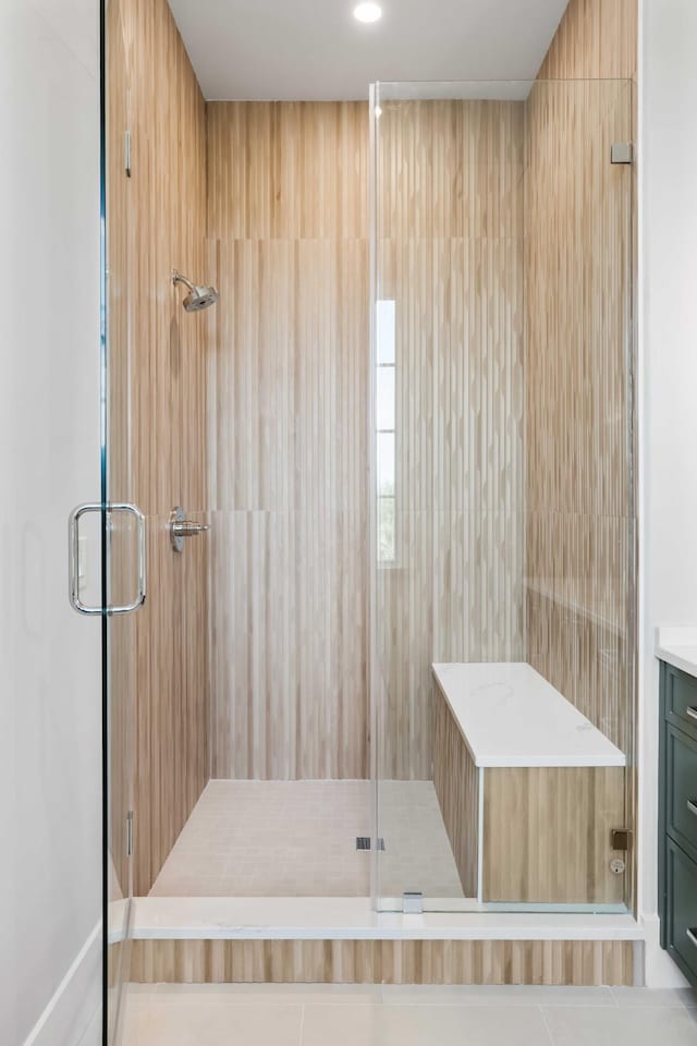 full bathroom with a stall shower and vanity