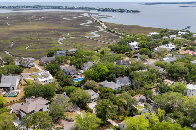 aerial perspective of suburban area featuring a nearby body of water