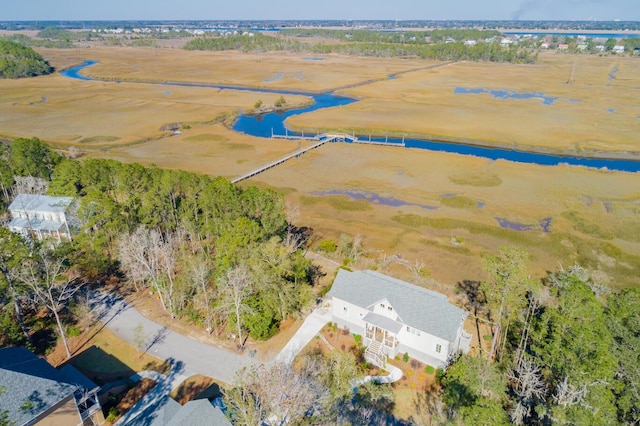 birds eye view of property with a water view and a rural view