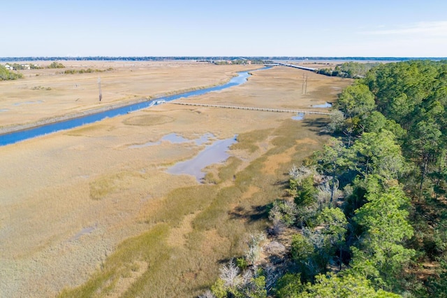 drone / aerial view featuring a water view and a rural view