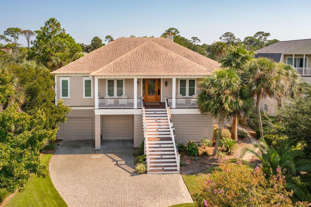 view of front of home with a carport and a porch