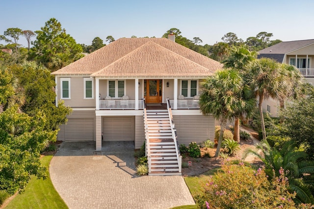 view of front of home with a carport and a porch