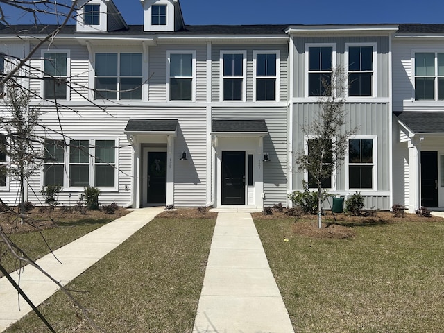 123 Brown Swiss Cir, Summerville, SC 29483 - townhome / multi-family property with a front lawn and a shingled roof