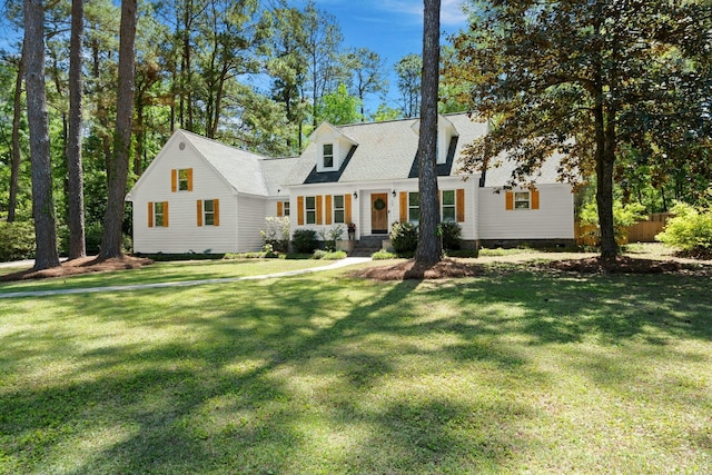 view of front of property with a front yard and fence
