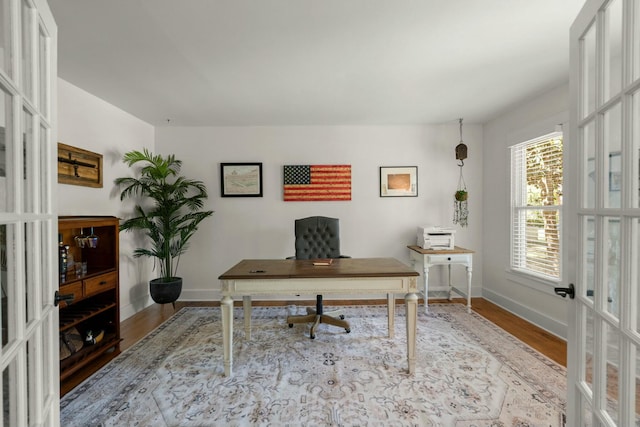 office space featuring wood finished floors and baseboards