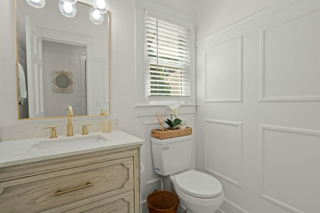 half bath with vanity and toilet