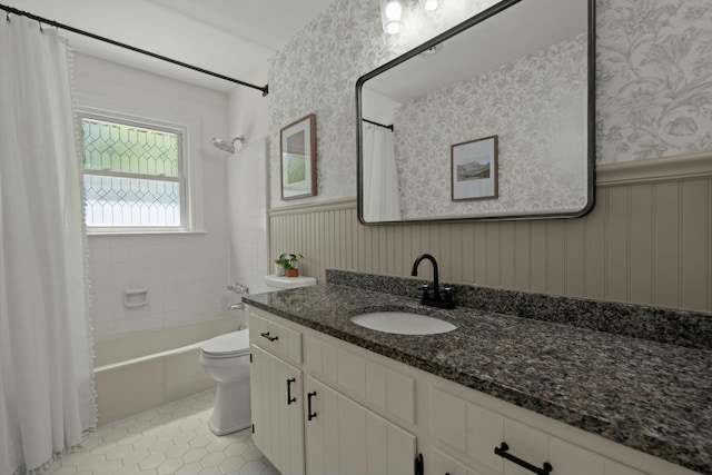 bathroom with wallpapered walls, tile patterned flooring, toilet, shower / bath combo with shower curtain, and wainscoting