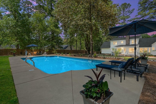 view of pool with a fenced in pool, a fenced backyard, and a patio