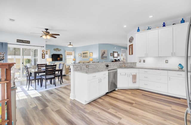3473 Plow Ground Rd, Johns Island, SC 29455 - kitchen with stainless steel dishwasher, a ceiling fan, a peninsula, white cabinetry, and light wood-type flooring