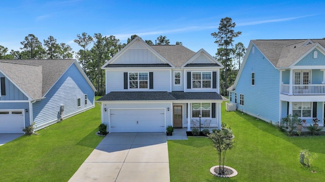 view of front of property with a balcony, a garage, and a front yard