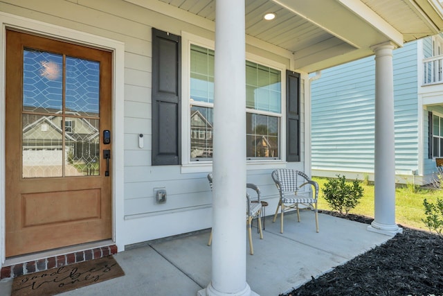 view of exterior entry featuring a porch