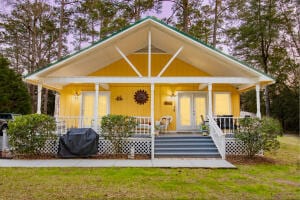 exterior space featuring a porch and a front lawn