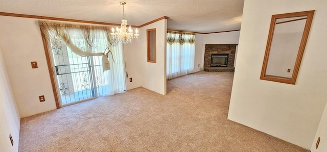 interior space with a chandelier, a fireplace, light colored carpet, and a textured ceiling