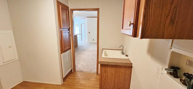 bathroom with hardwood / wood-style floors and sink