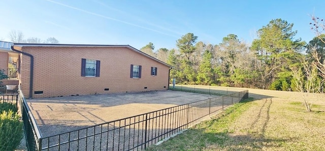 back of house with a lawn