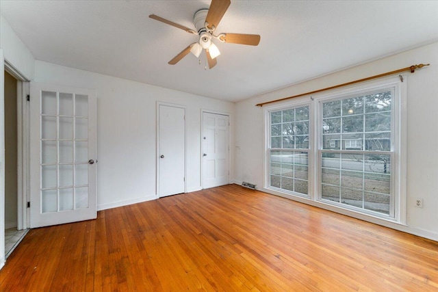 unfurnished bedroom with hardwood / wood-style flooring and ceiling fan