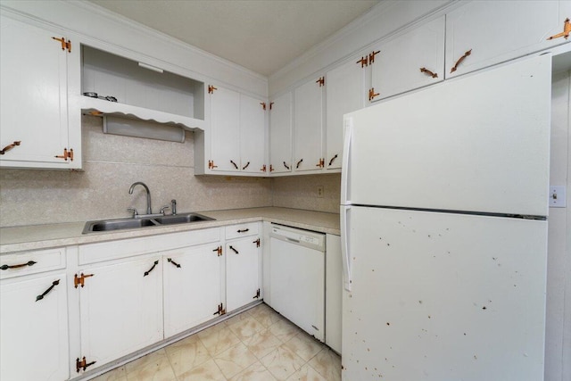 kitchen featuring white cabinetry, sink, white appliances, and tasteful backsplash