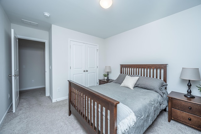 carpeted bedroom with a closet