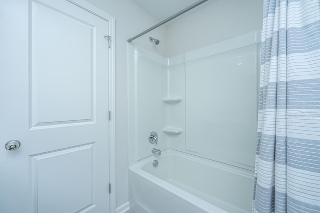 bathroom with shower / tub combo with curtain