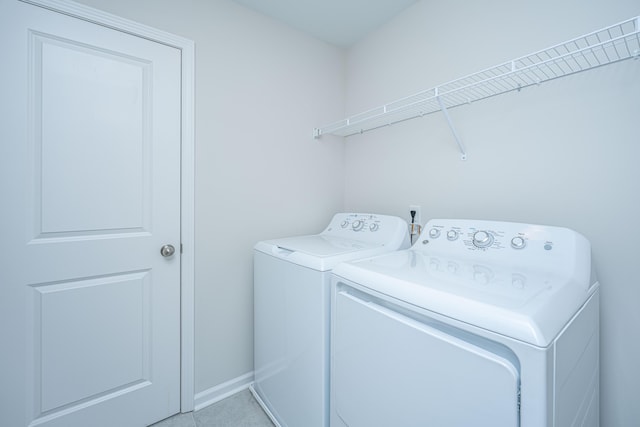 washroom with independent washer and dryer