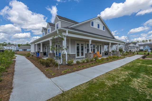 view of property exterior featuring a porch and a yard