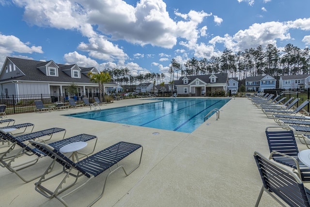 view of swimming pool with a patio