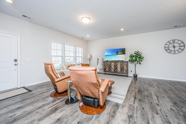 living area with wood-type flooring